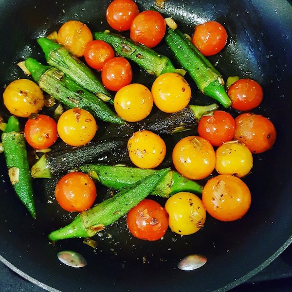 Three Sisters Okra and Tomatoes cooking in a pan.